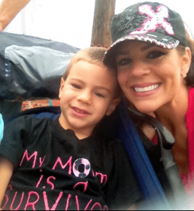 Stephanie Seager smiles next to her son, outside