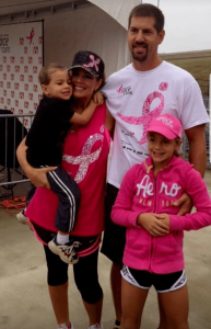 Stephanie Seager smiles with her husband and two children at a cancer benefit event