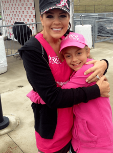 Stephanie Seager smiles with her daughter at a cancer benefit event